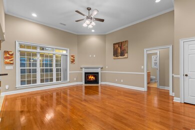 Unfurnished living room featuring ornamental moldi