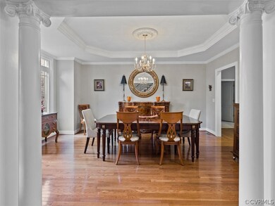 The dining room is open to the foyer with picture