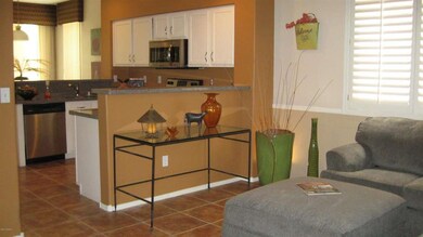 KITCHEN W/ PARTIAL OF FAMILY ROOM