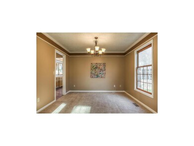The dining room flows to the breakfast room and ki