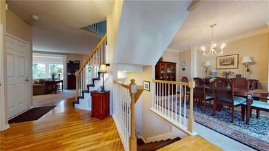 Open and airy entry with beautiful hardwood floors