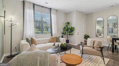 Pearson townhome living room with a large window for natural light