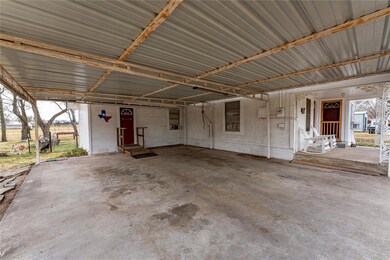 View of patio featuring a carport