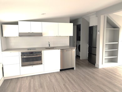 The kitchen and refrigerator.