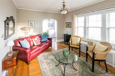 Sun-filled living room with beautiful hardwood flo