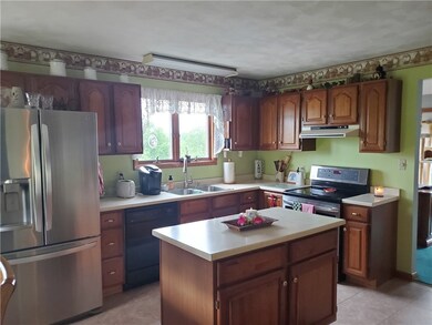 Gorgeous kitchen features kitchen island and stain