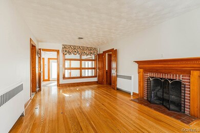 Hardwood floors and gas log fireplace in living ro