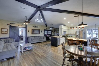 Dining room featuring vaulted ceiling with beams, 