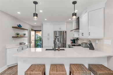 Kitchen featuring recessed lighting, wall chimney
