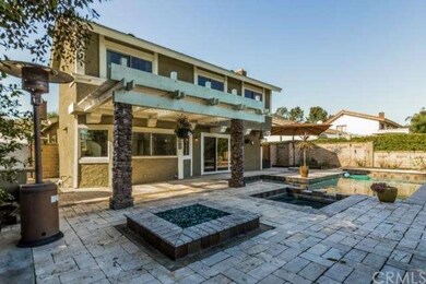 Rear view of patio pool, spa and fire pit