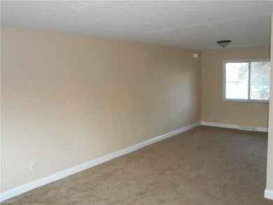 The L-shaped living room / dining room.