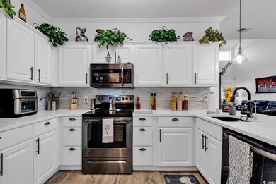 Kitchen with appliances with stainless steel finis