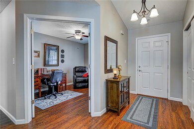Foyer with laminate hardwood floors.....don't miss the extra large closets for all your storage needs!