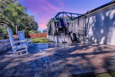 Stunning, custom paver patio takes in the peaceful, PRIVATE views of the large backyard