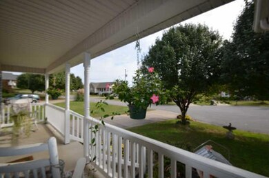 View Of Front Lawn From Covered Porch Located In A Quite Cul-De-Sac
