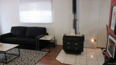 Living room with wood-type flooring and natural li
