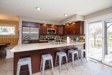 Large granite counter that fits up to five stools 