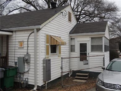 Enclosed porch with access to the backyard