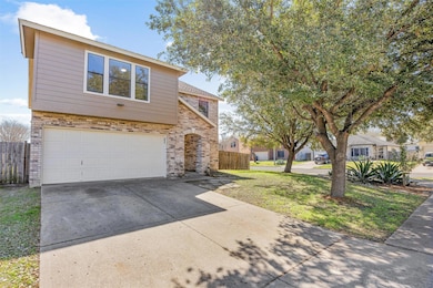 View of front of home featuring brick siding, an 