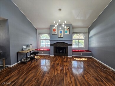 Living room featuring baseboards, a wealth of natu