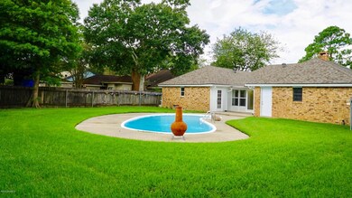 Yard view of house and Sunroom