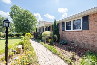 View of home's exterior with a lawn