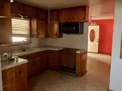Kitchen has plenty of storage and a large pantry.