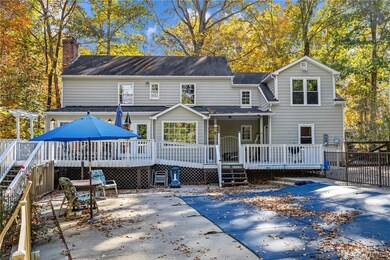 Back of house with a wooden deck