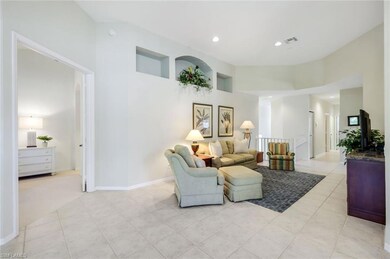 Living room featuring light tile patterned floors,