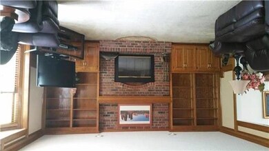 Over sized family room with fireplace, built ins a
