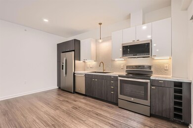 Kitchen featuring stainless steel appliances, a s