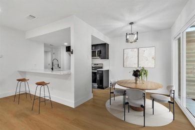 Dining space featuring light wood-style floors, a