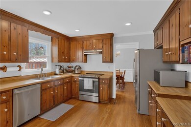 Kitchen with crown molding, sink, appliances with
