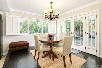 Dining area leading through French Doors to Pool a