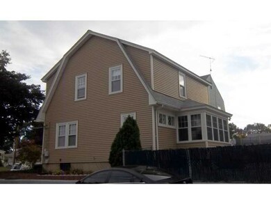 Exterior Back. Enclosed porch at rear