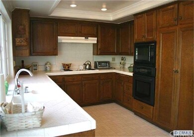 Kitchen with custom lighting overhead