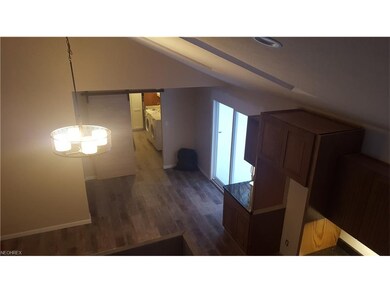 Kitchen and dining area looking into the utility r