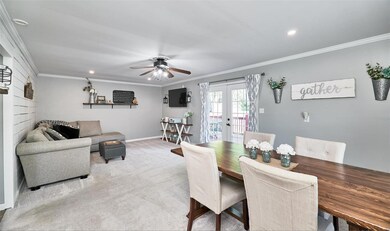 Dining/family room with French doors leading to de