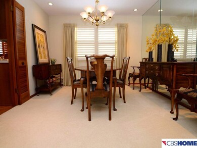 Look out into the park-like back yard from this beautiful large dining room.