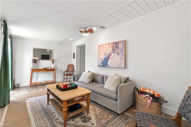 Living room with wood-type flooring