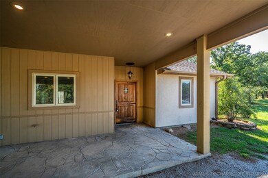 Covered porch and solid wood entry door.