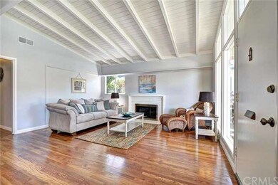 Enter into the living room with cozy fireplace and