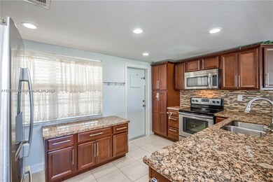 Granite counters with plenty of counterspace for prepping.