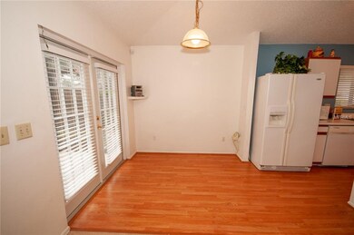 Breakfast Nook with laminate floors and french doo