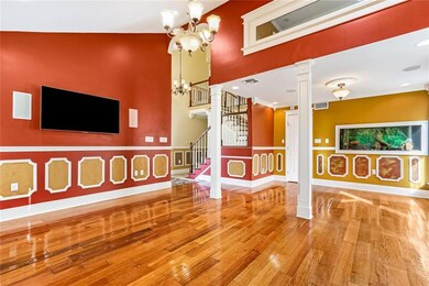 Large Living room with high ceiling and built-in f
