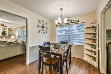Charming breakfast room with crown molding, chair rail and recent paint.