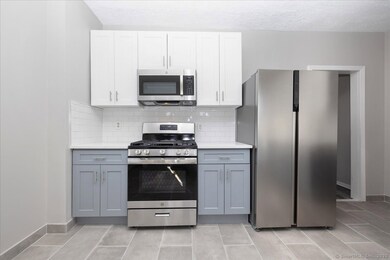 Large and brand new eat in kitchen, with quartz co