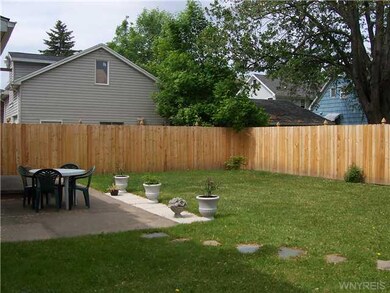 Backyard New stockade fence encloses back yard