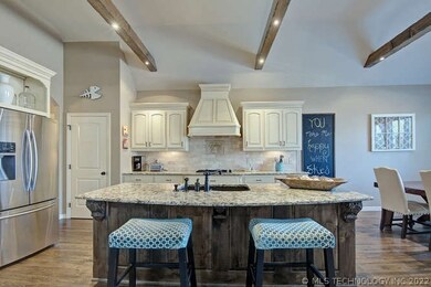 Open kitchen with large island and custom cabinets