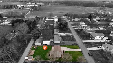 Aerial view of street highlighting the home